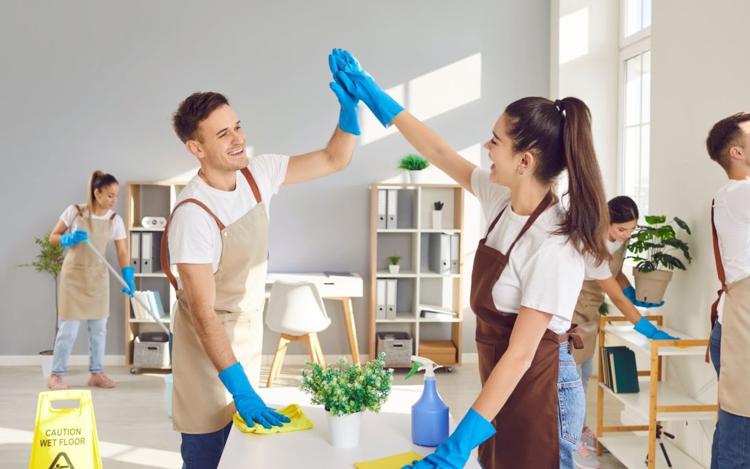 A team of professionals diligently cleaning a room, showcasing the gift of cleanliness and the joy of gifting cleaning services